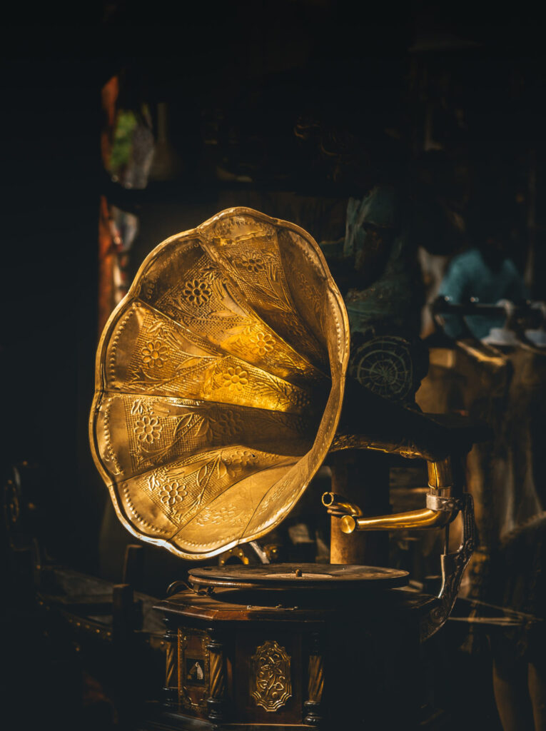 antique gramaphone against dark backdrop 